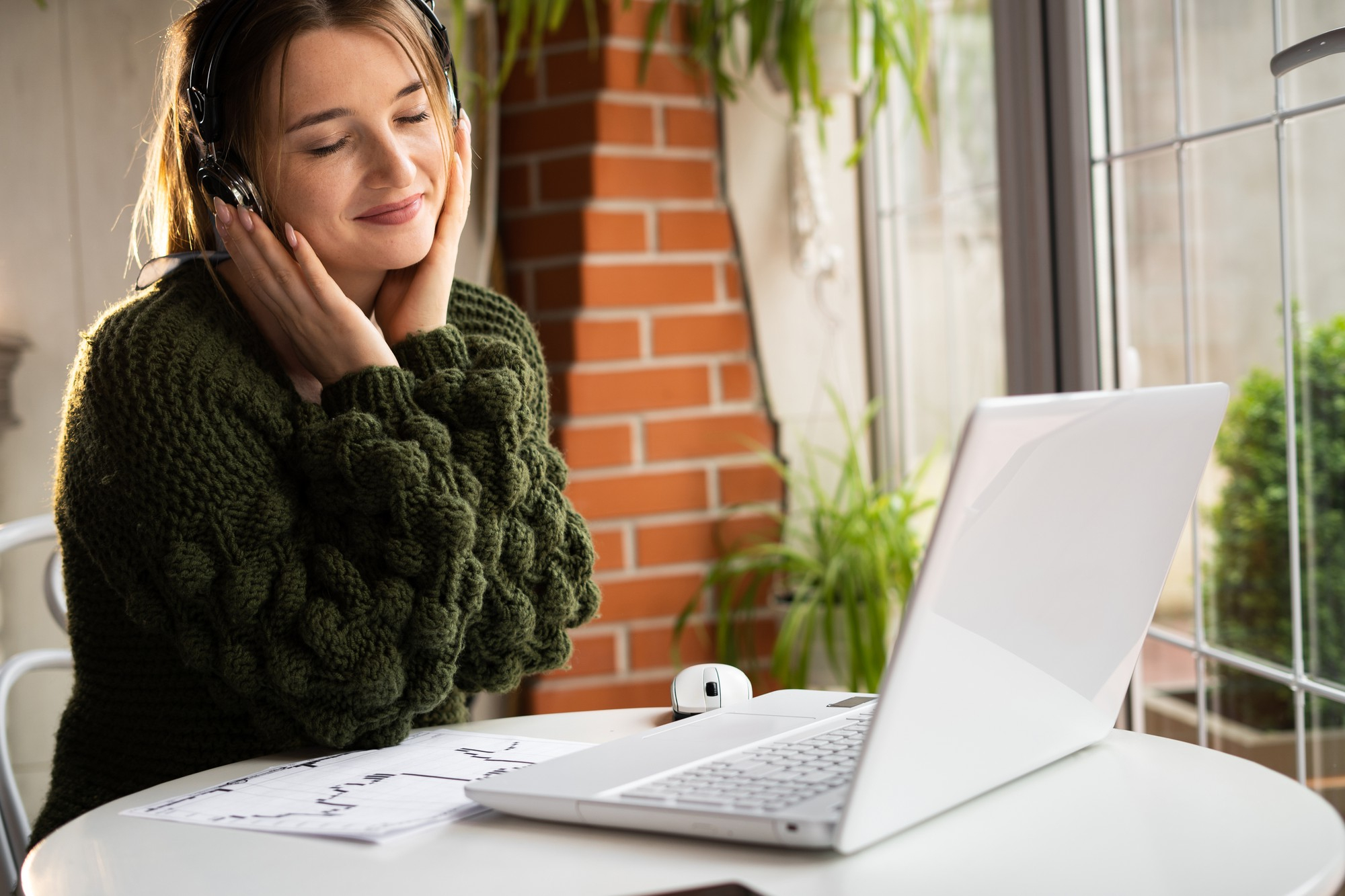 Millennial young woman enjoys the sound of music